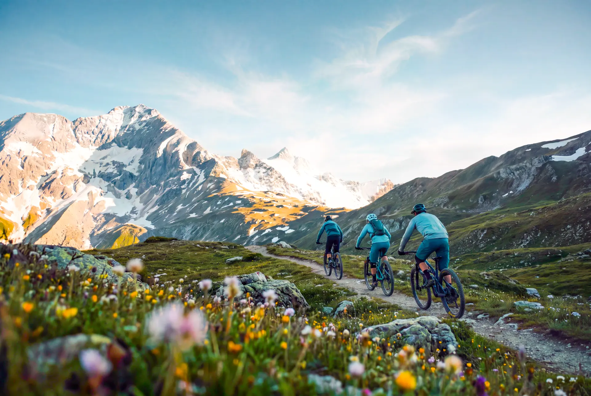 Mountain biker on an alpine trail in summer