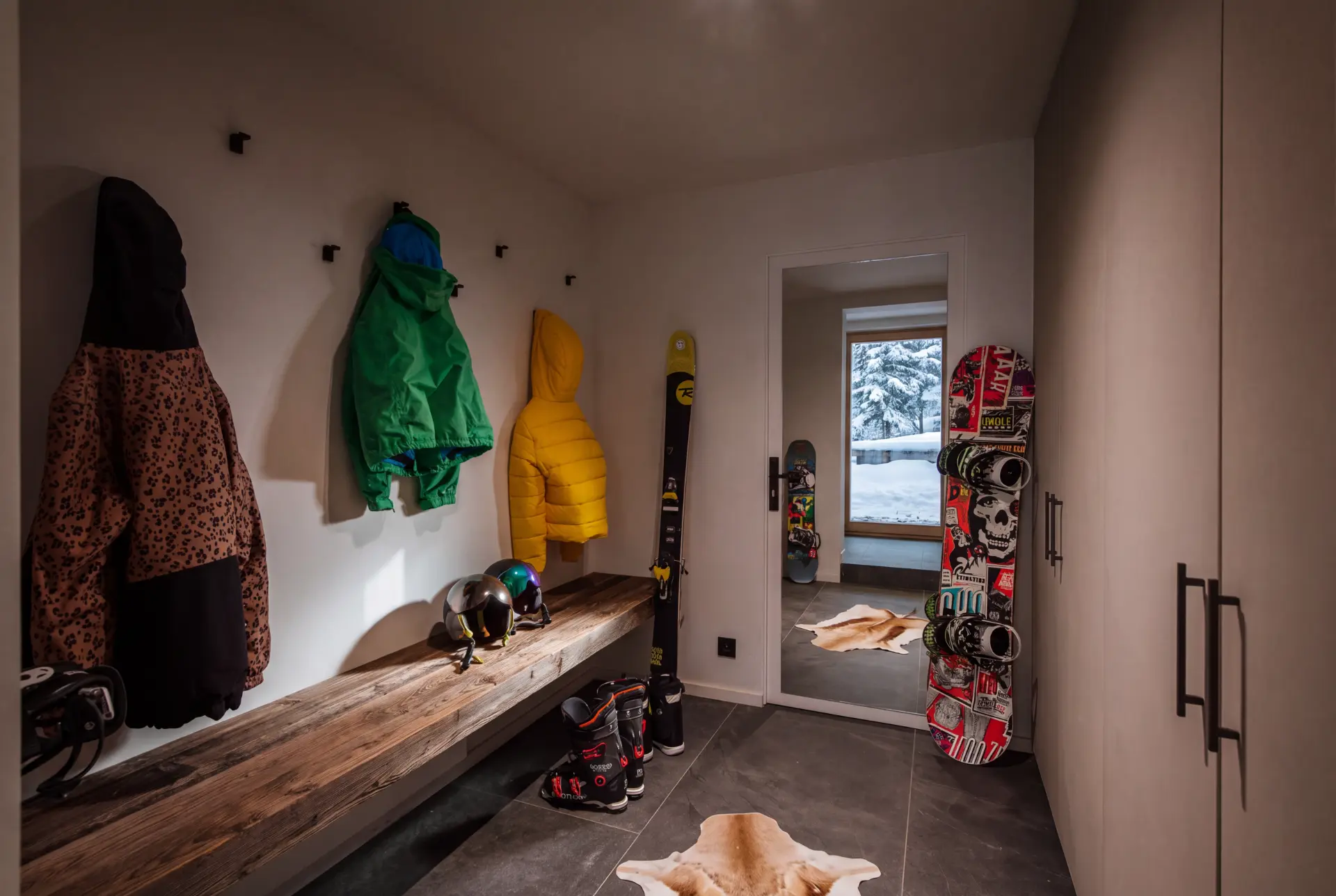 Heated ski room with racks for skis, boards and boots